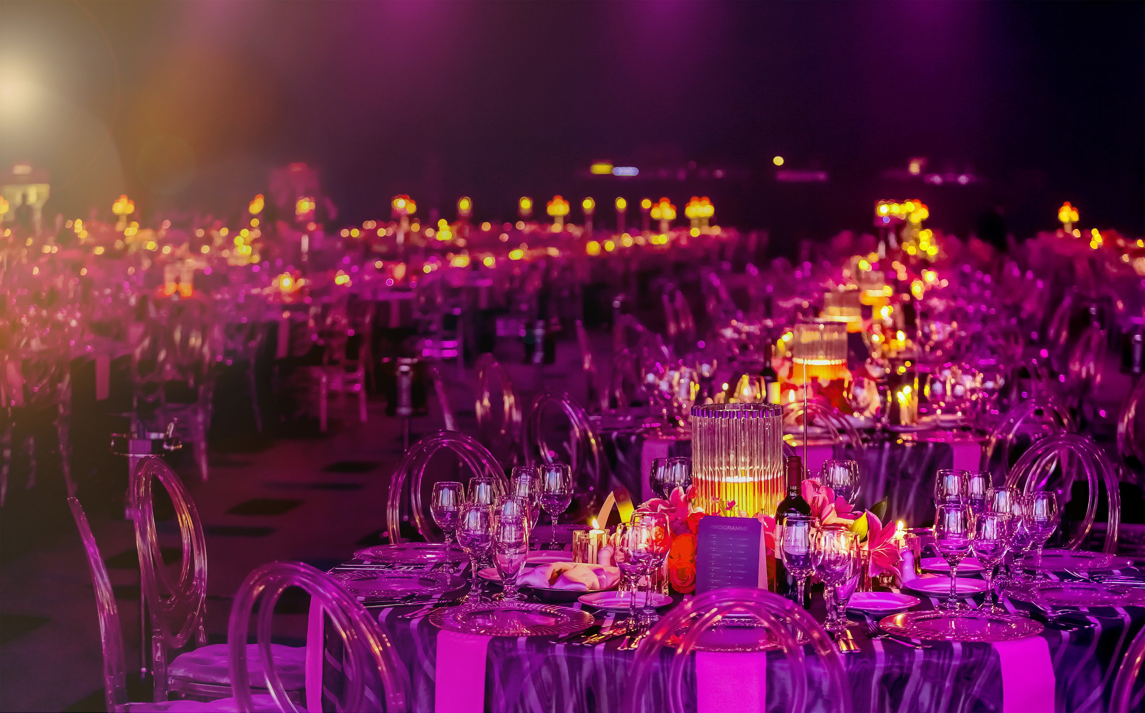 Pink and Purple Christmas Decor with candles and lamps for a large party or Gala Dinner